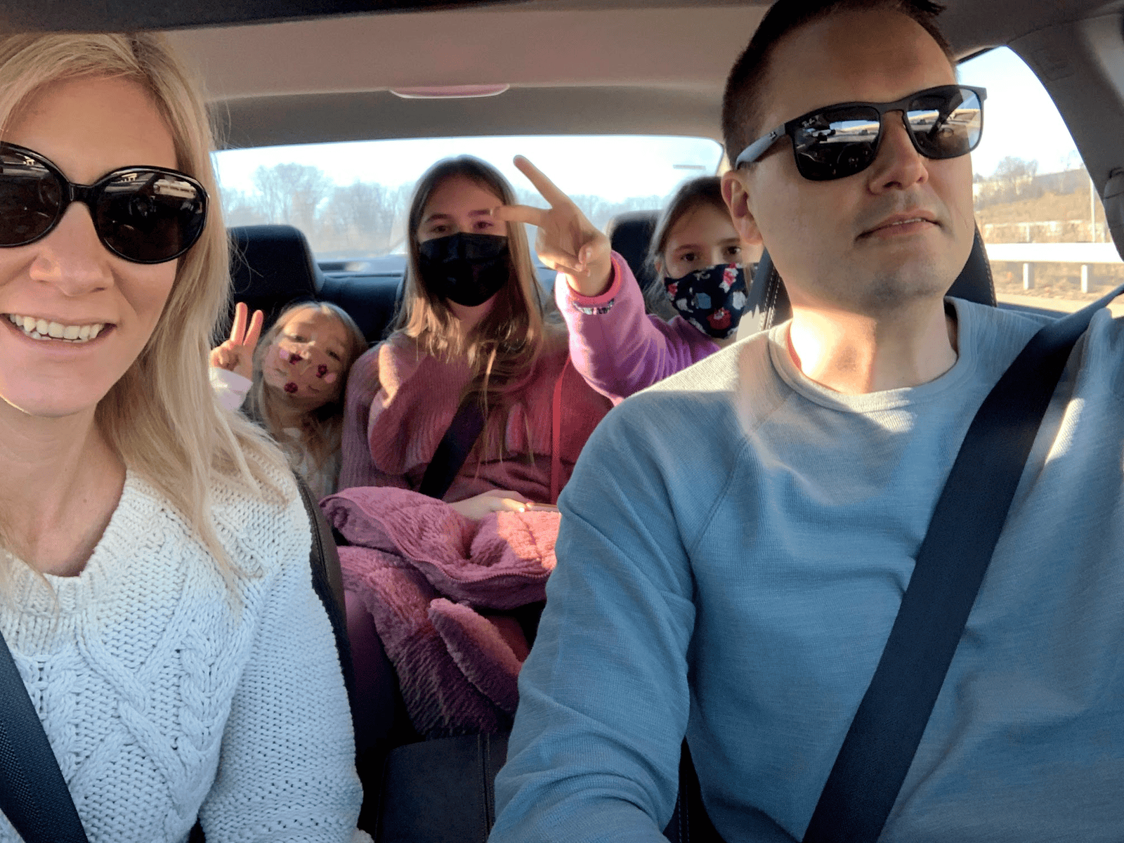 family inside a car